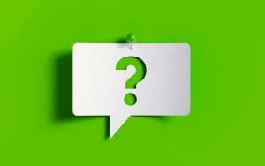 Green question mark on speech bubble, pinned to green background